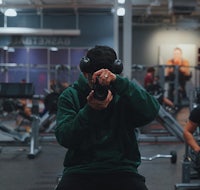 a man taking a picture in a gym